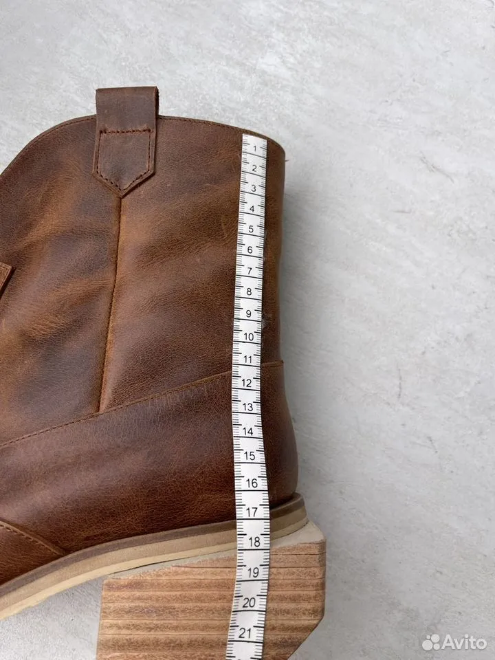 Женские сапоги-казаки из натуральной кожи с скошенным каблуком